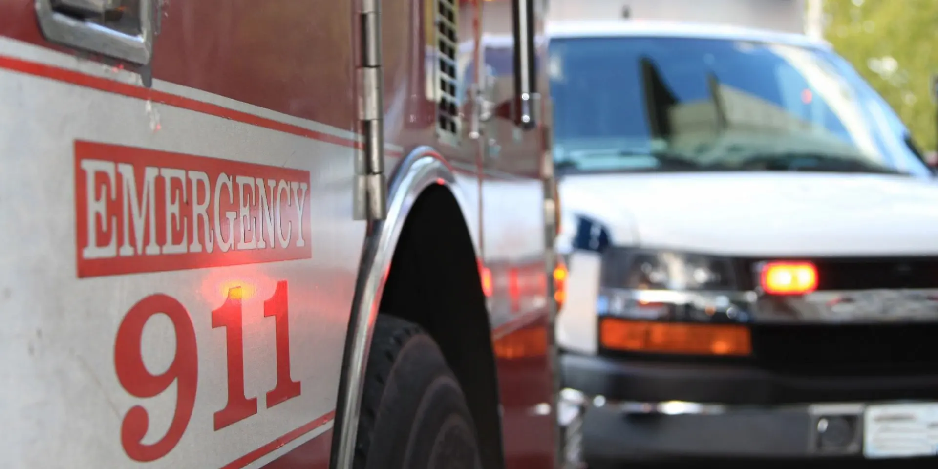 A fire truck is parked next to another fire truck.